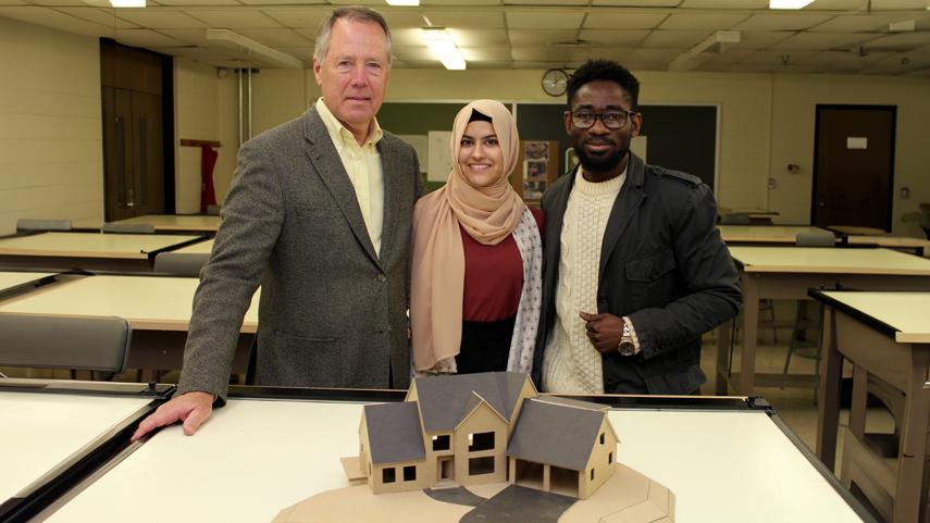 Architecture Students with professor and model