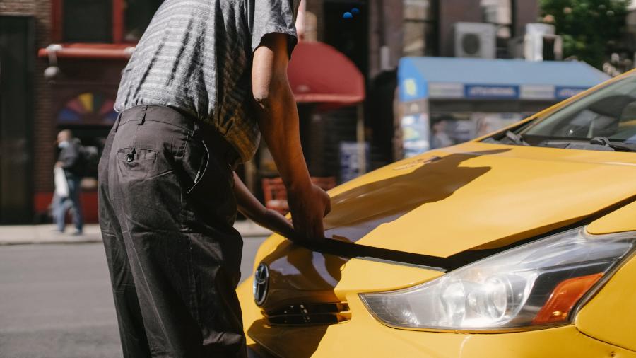 man opening car hood